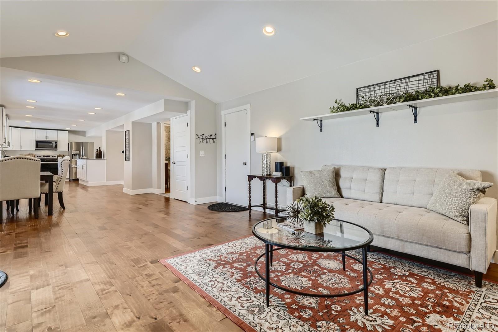 4165 East Peakview Circle Centennial, CO 80121 - Photo 11 of 27 a living room with furniture and kitchen view