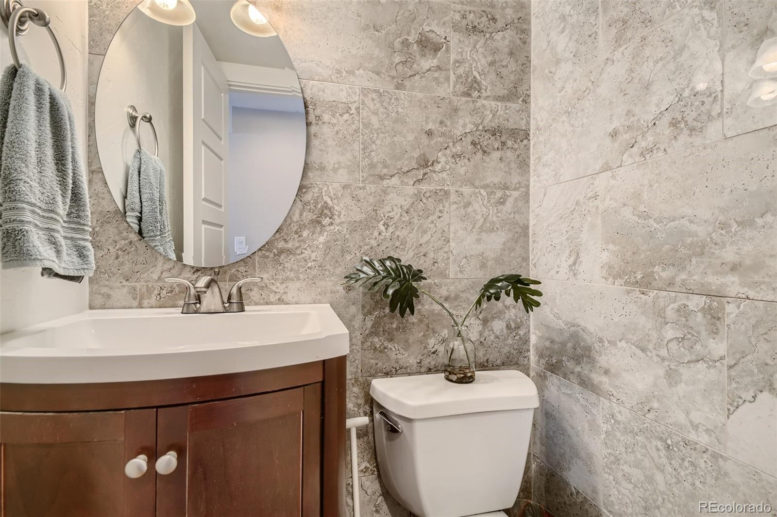 4165 East Peakview Circle Centennial, CO 80121 - Photo 12 of 27 a bathroom with a sink and a mirror