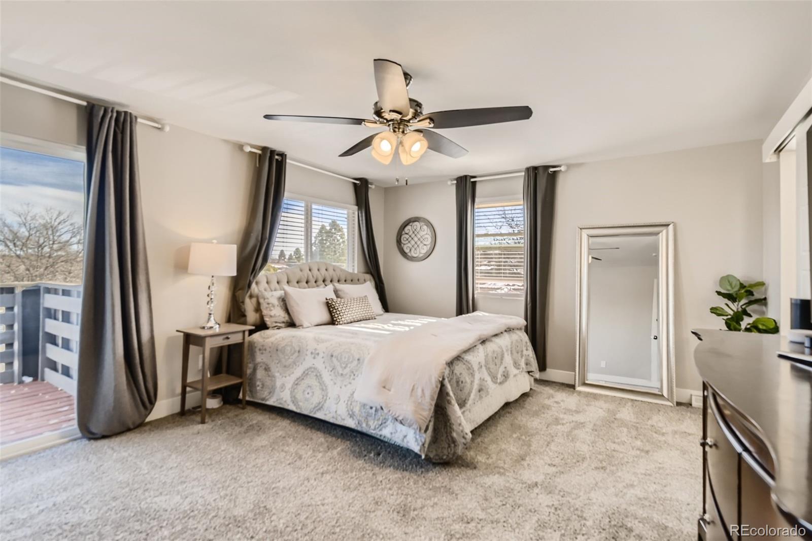 4165 East Peakview Circle Centennial, CO 80121 - Photo 13 of 27 a bedroom with a bed dresser and a window