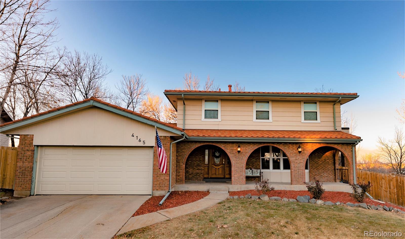 4165 East Peakview Circle Centennial, CO 80121 - Photo 2 of 27 a front view of a house with yard