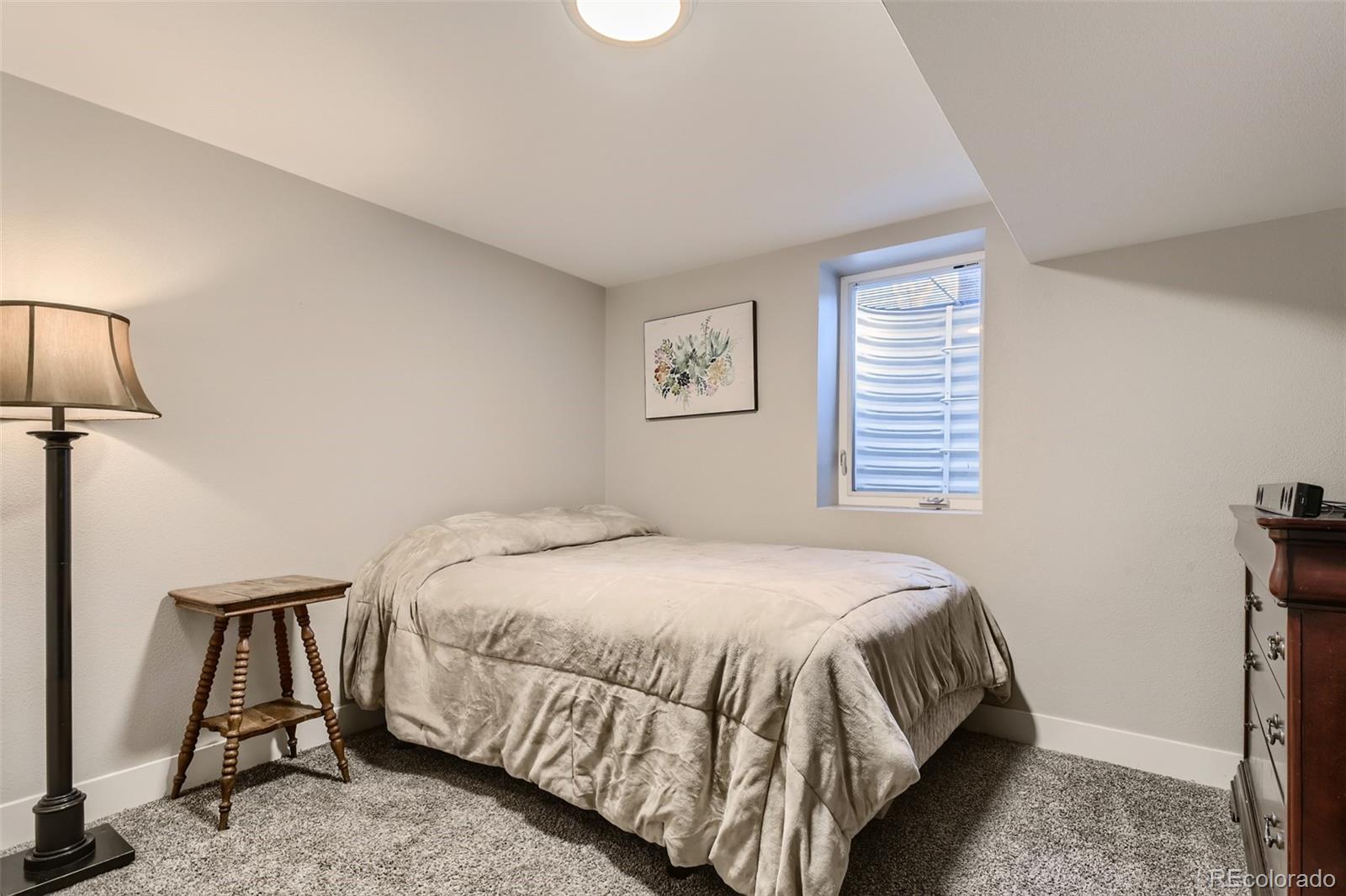 4165 East Peakview Circle Centennial, CO 80121 - Photo 21 of 27 a bedroom with a bed and a window