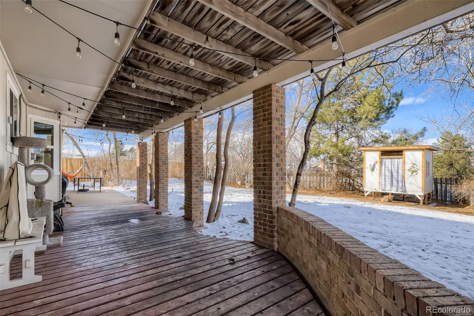 4165 East Peakview Circle Centennial, CO 80121 - Photo 25 of 27 a view of a porch with wooden floor