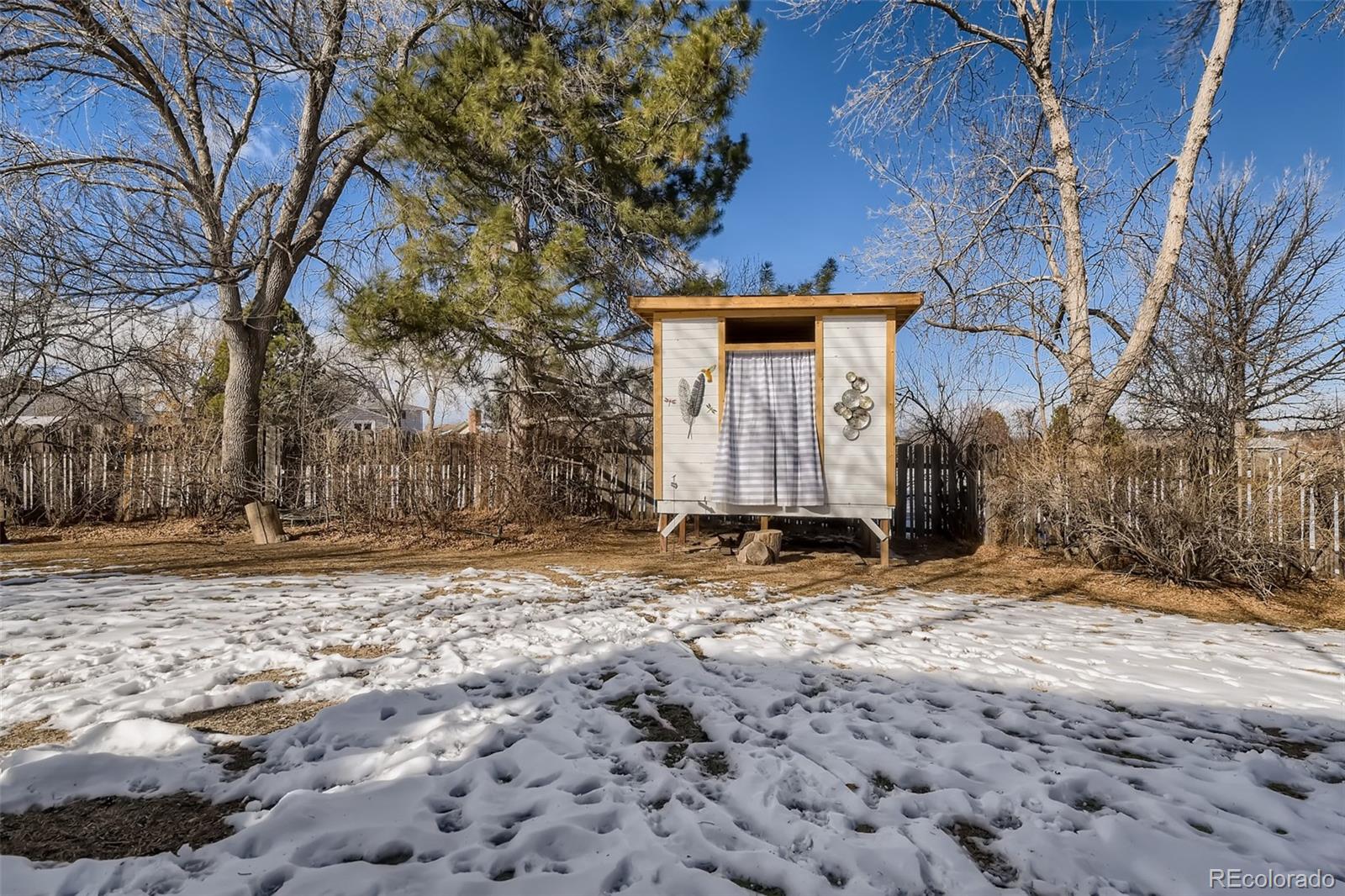 4165 East Peakview Circle Centennial, CO 80121 - Photo 26 of 27 a view of a house with a yard