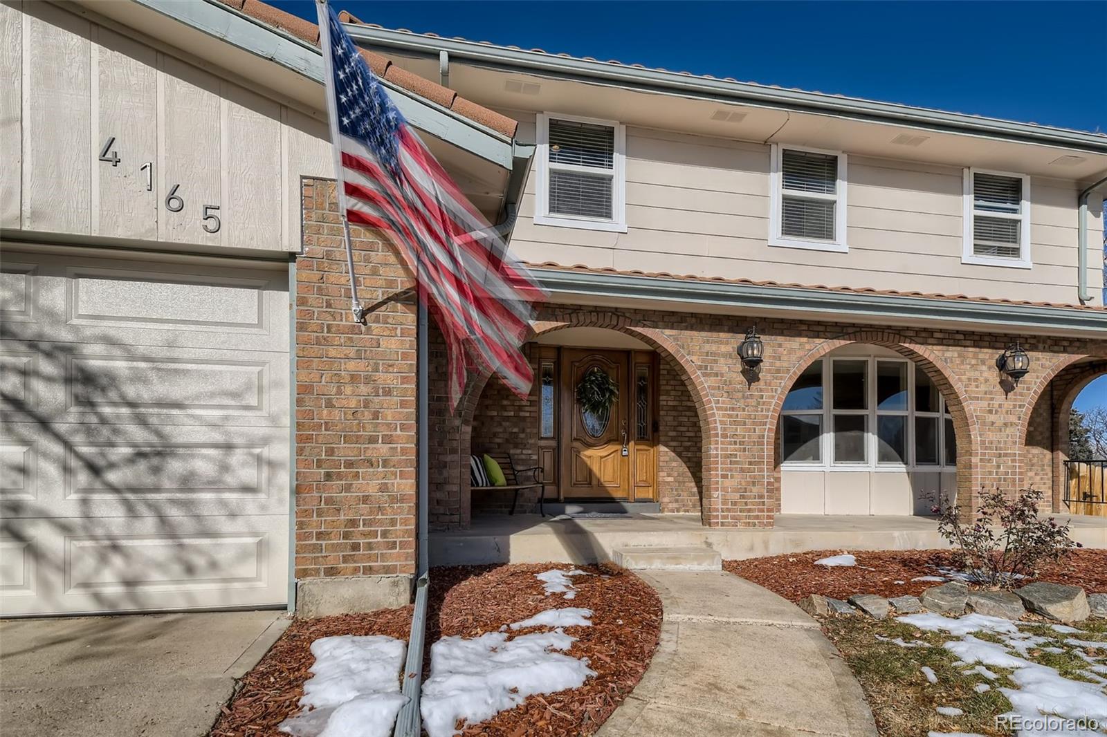 4165 East Peakview Circle Centennial, CO 80121 - Photo 3 of 27 a view of a house with entryway doors
