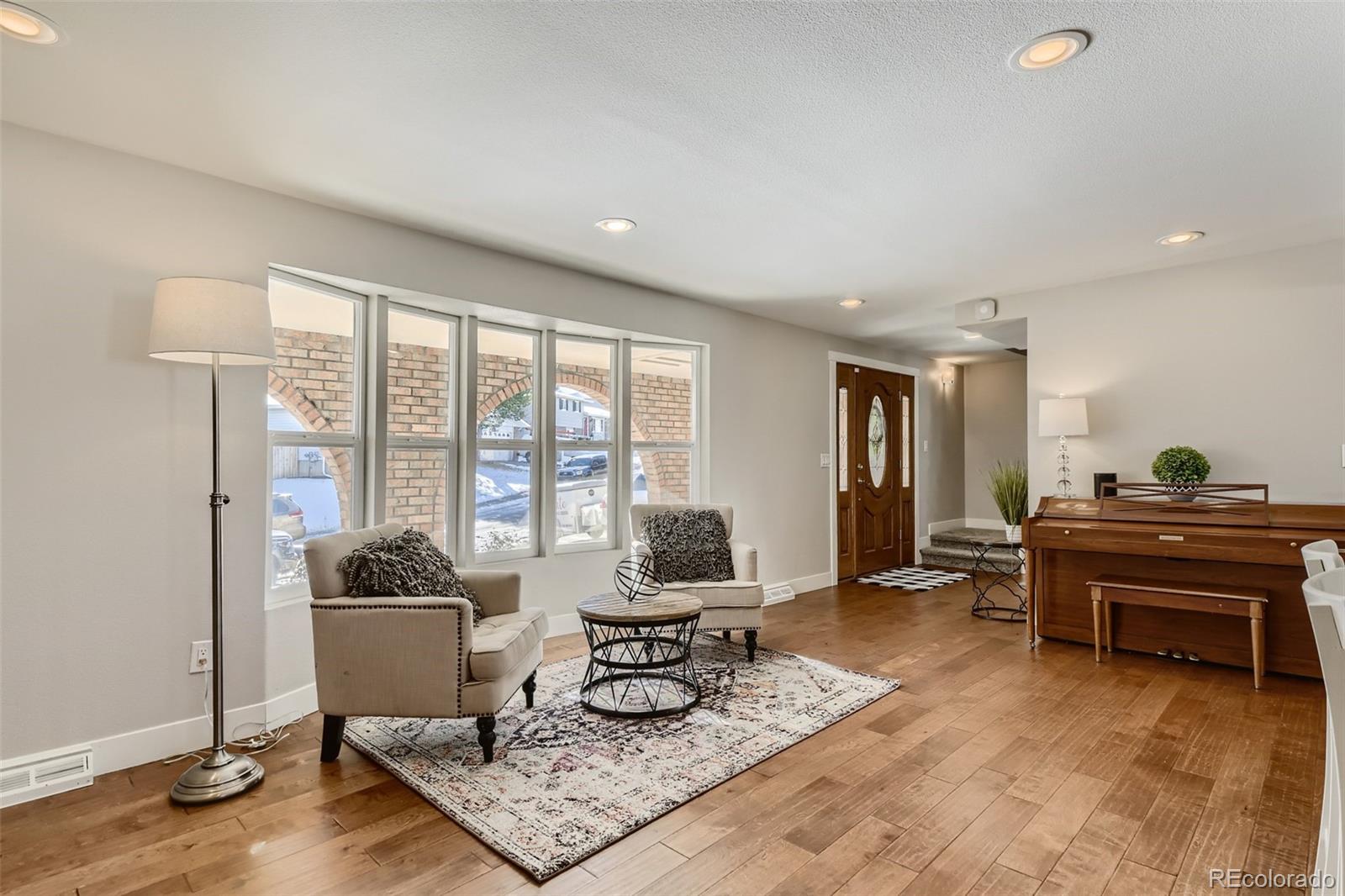 4165 East Peakview Circle Centennial, CO 80121 - Photo 5 of 27 a living room with furniture and a window