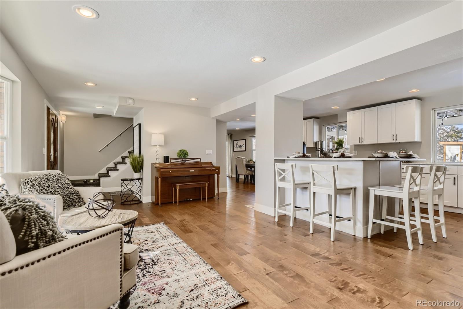 4165 East Peakview Circle Centennial, CO 80121 - Photo 7 of 27 a living room with furniture and a wooden floor