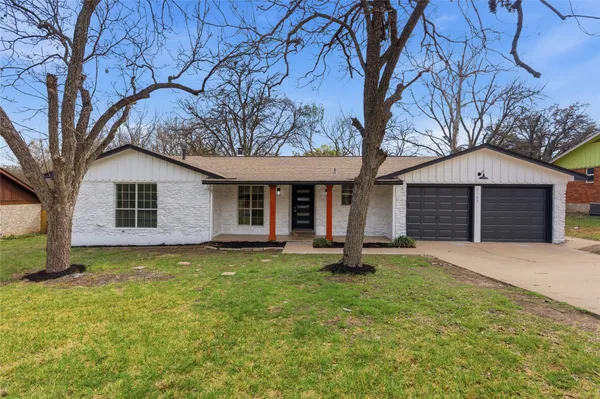 a backyard of a house with seating space