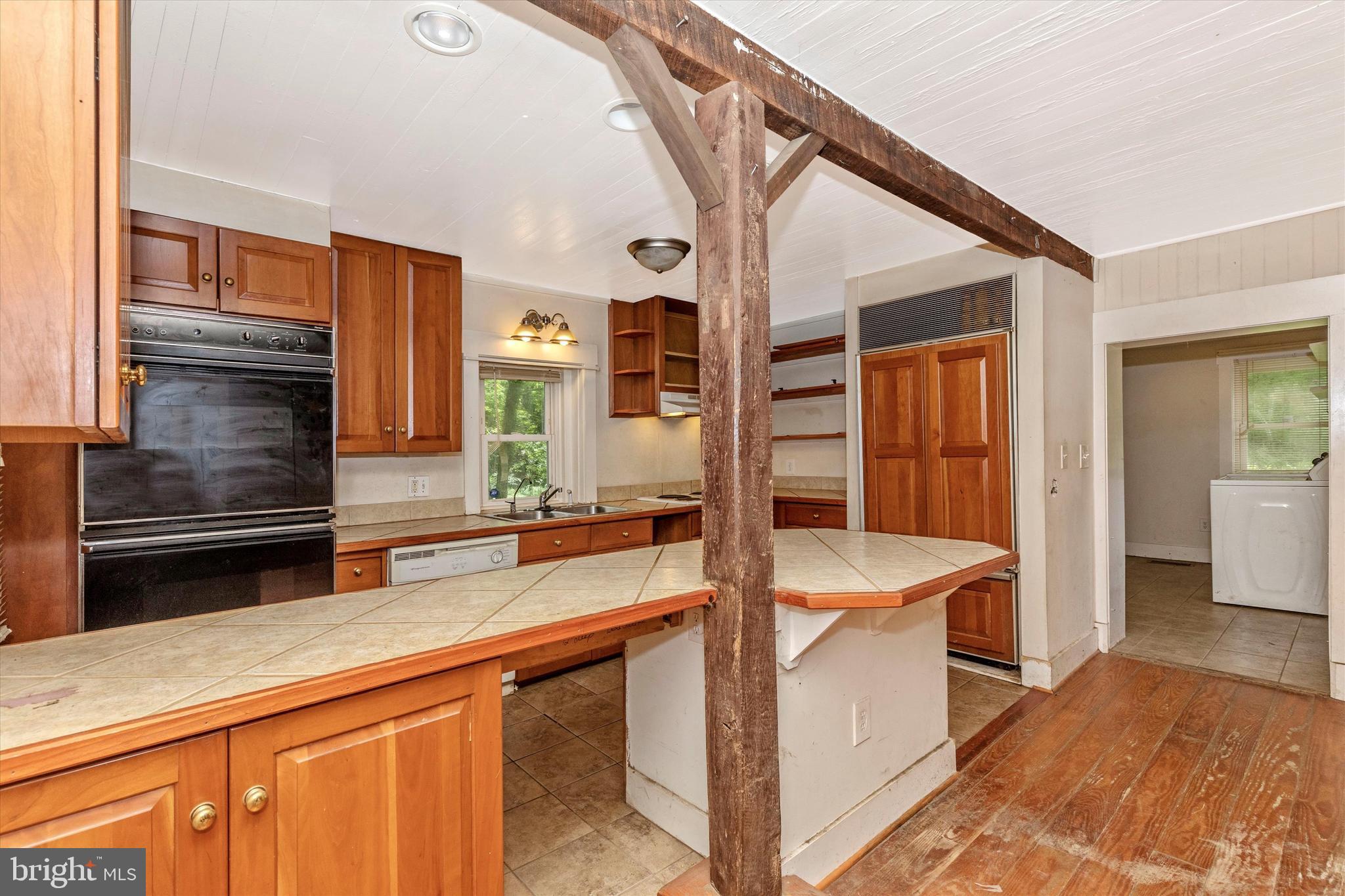 6300 Old Bohn Road Mount Airy, MD 21771 - Photo 15 of 45 a kitchen with a sink and a refrigerator
