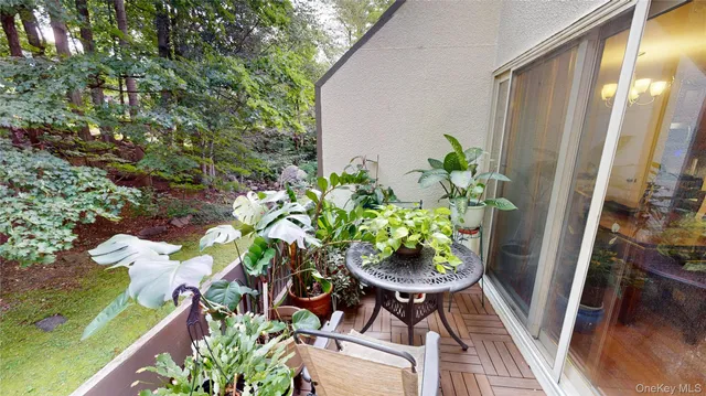 a backyard of a house with outdoor seating