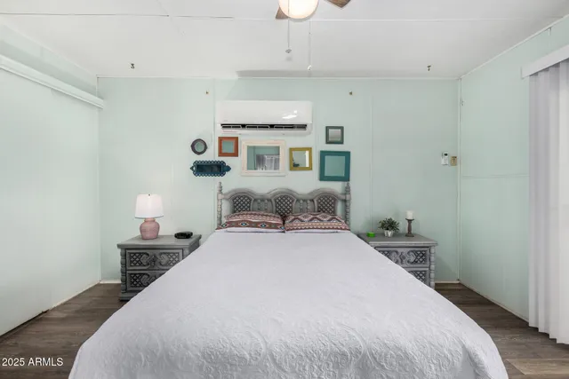 a bedroom with a bed and a lamp