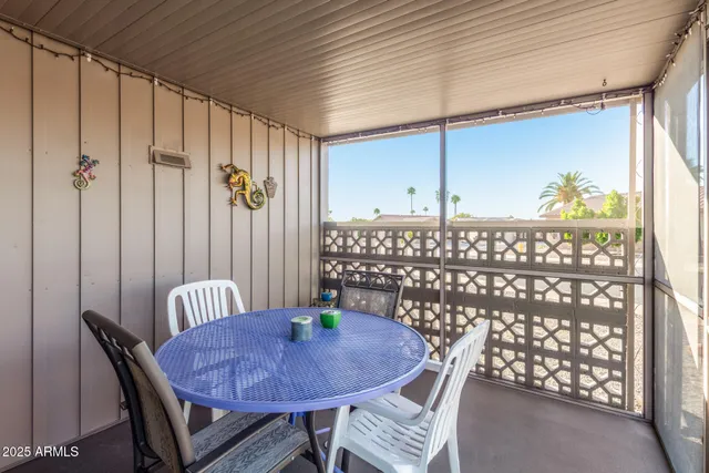 a view of a chairs and table in a room