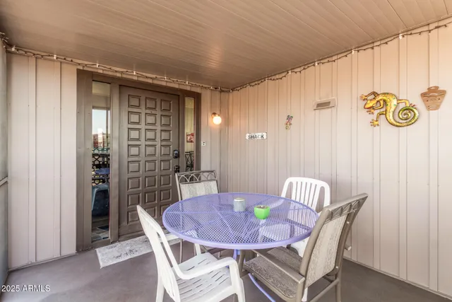 a view of a dining room with furniture and a window