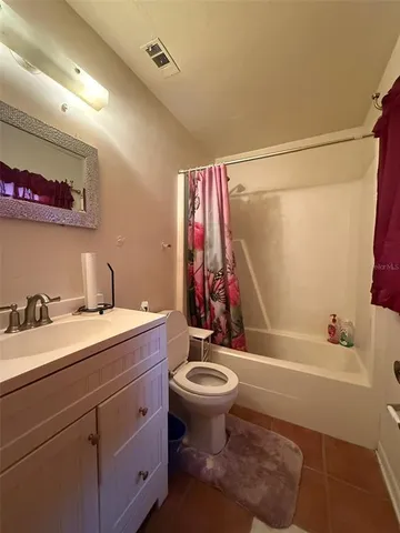 a bathroom with a sink toilet tub and shower