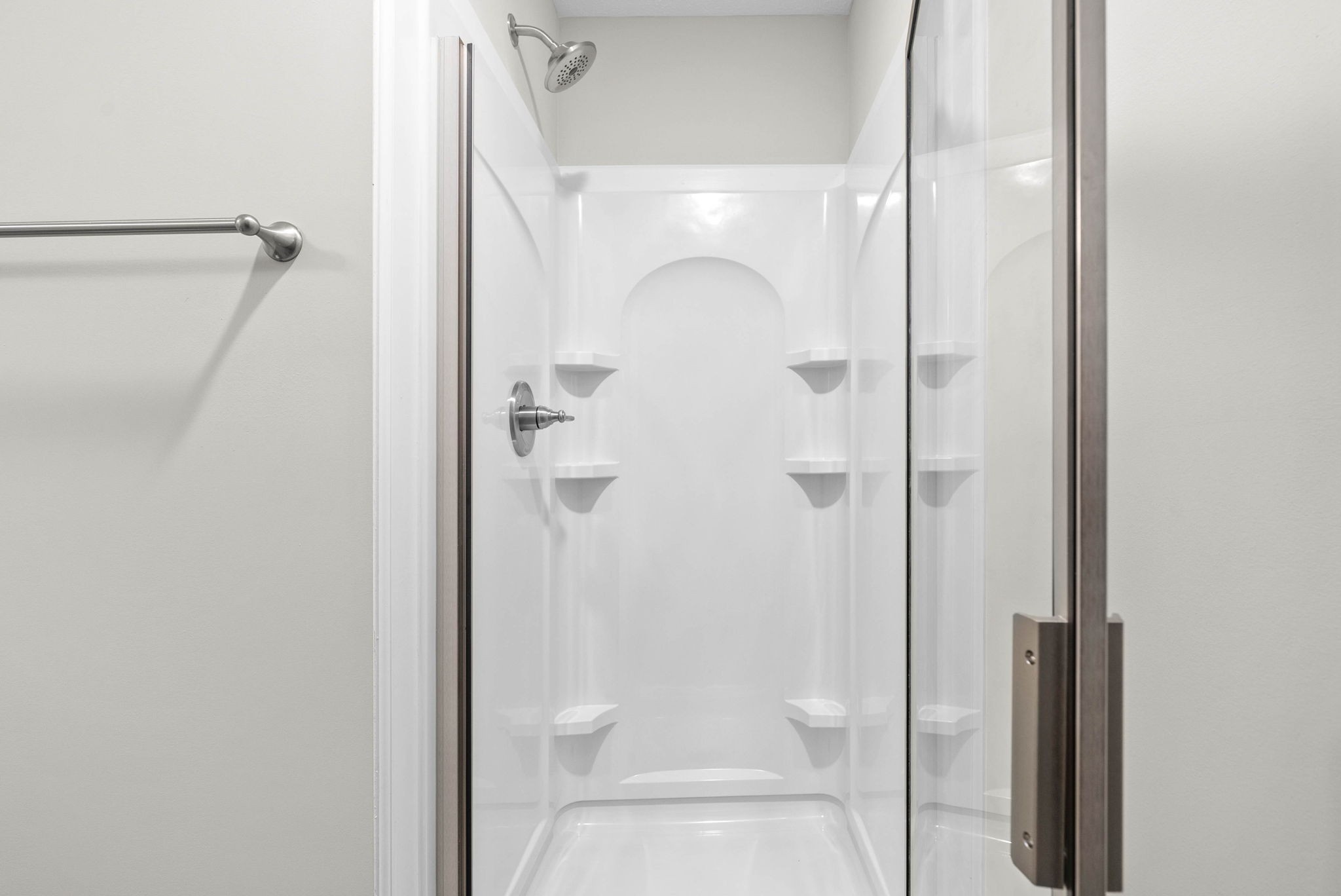 317 Longshadow Trail, Unit F Clarksville, TN 37043 - Photo 19 of 30 a bathroom with a glass shower door