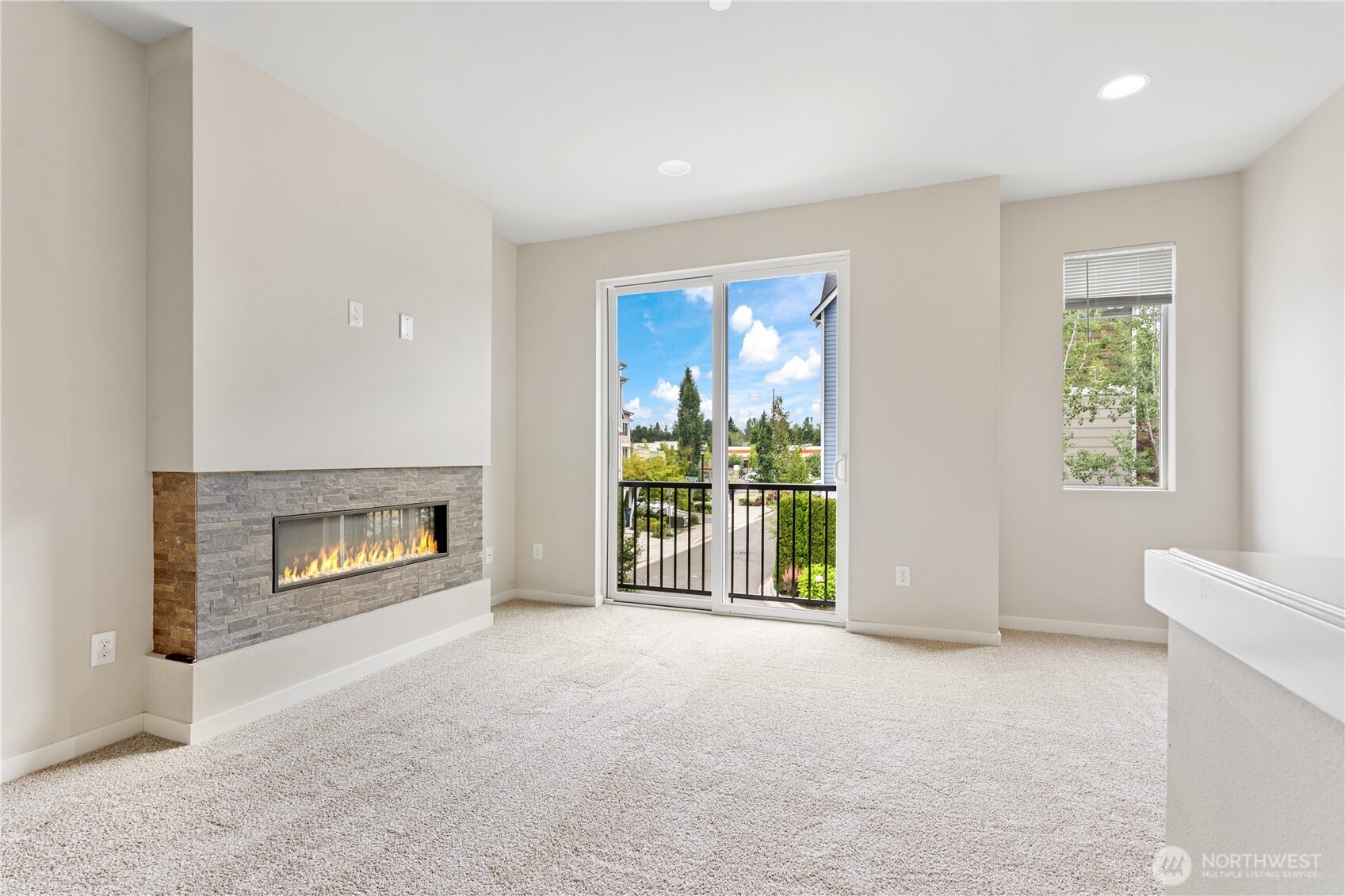 4239 Northeast 3rd Lane Renton, WA 98059 - Photo 15 of 28 an empty room with furniture and a fireplace