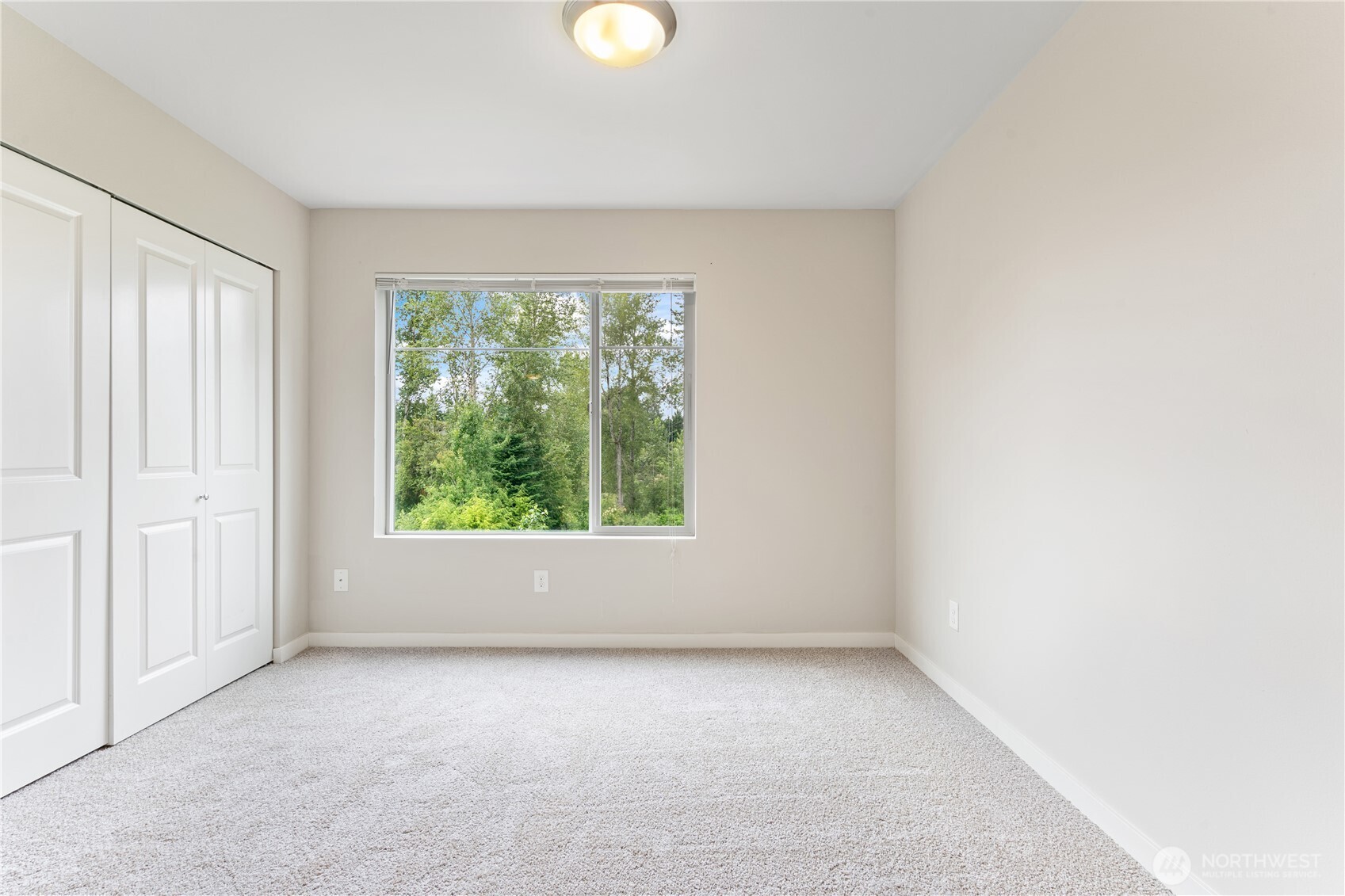 4239 Northeast 3rd Lane Renton, WA 98059 - Photo 20 of 28 an empty room with windows