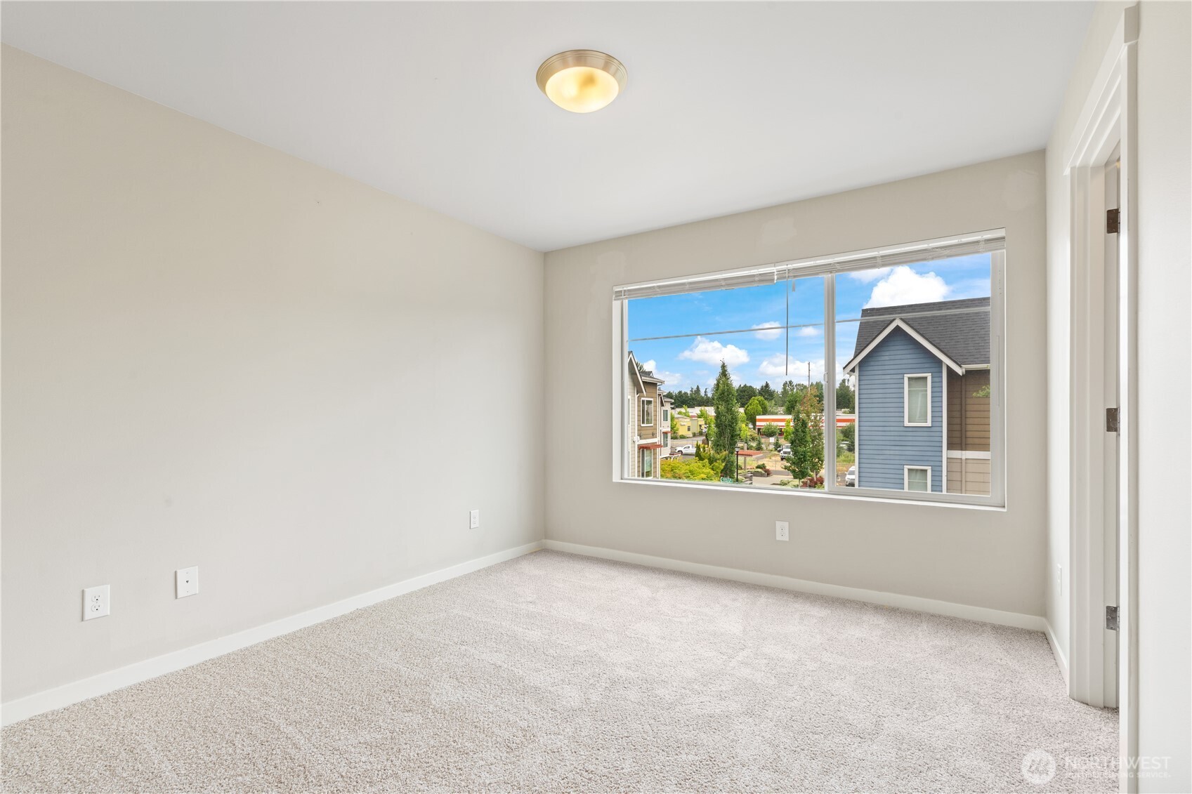 4239 Northeast 3rd Lane Renton, WA 98059 - Photo 23 of 28 an empty room with windows
