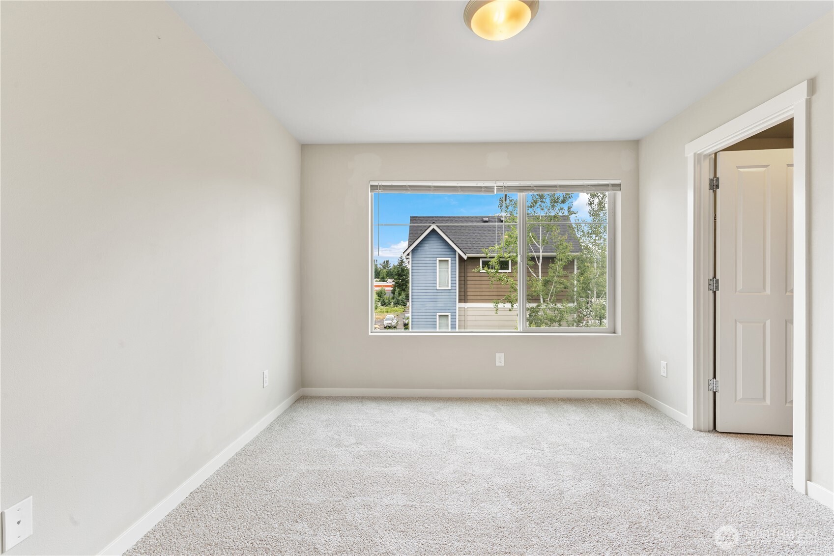 4239 Northeast 3rd Lane Renton, WA 98059 - Photo 25 of 28 an empty room with windows and mirror