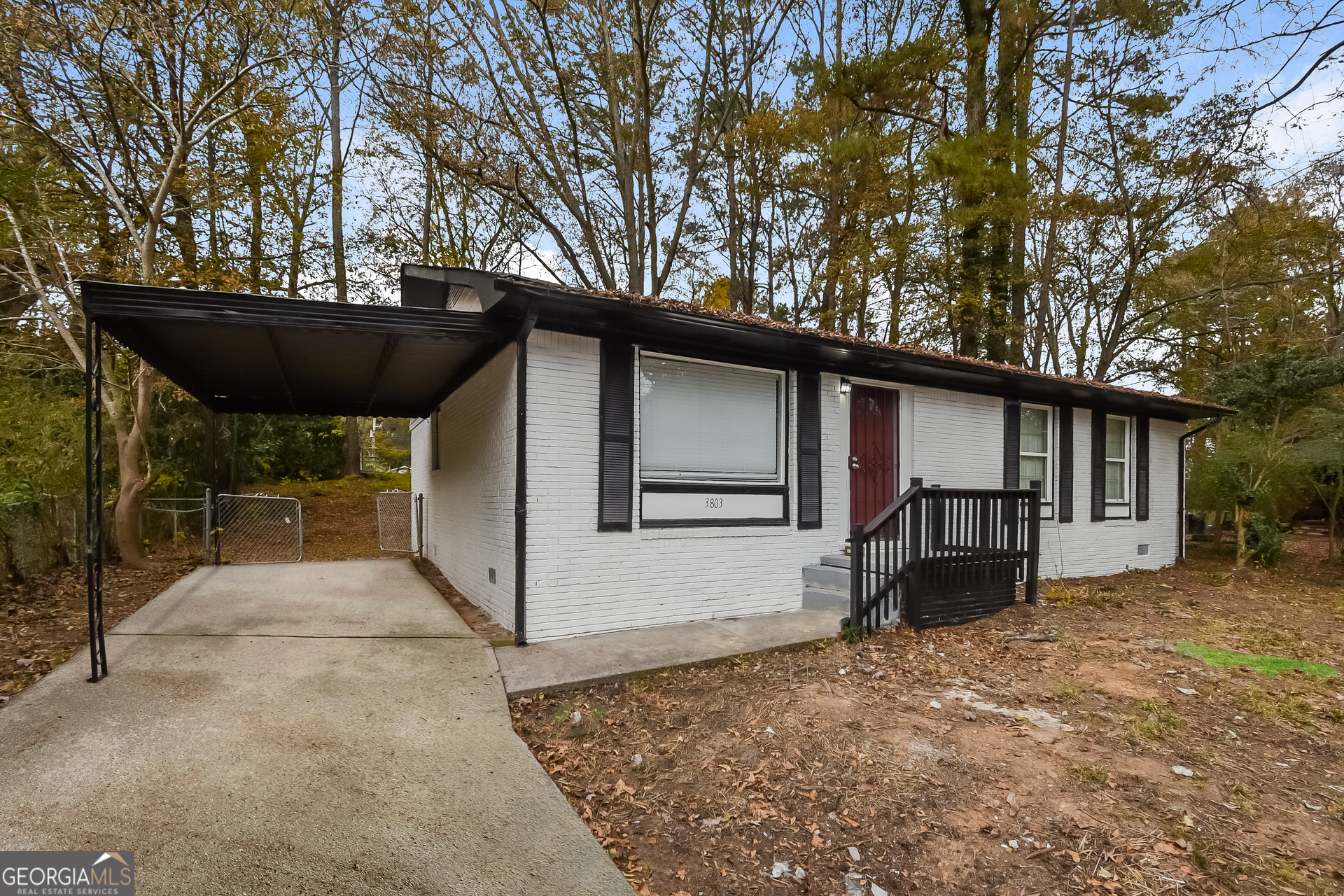 3803 Bakers Ferry Road Southwest Atlanta, GA 30331 - Photo 2 of 16 a view of a house with backyard and sitting area