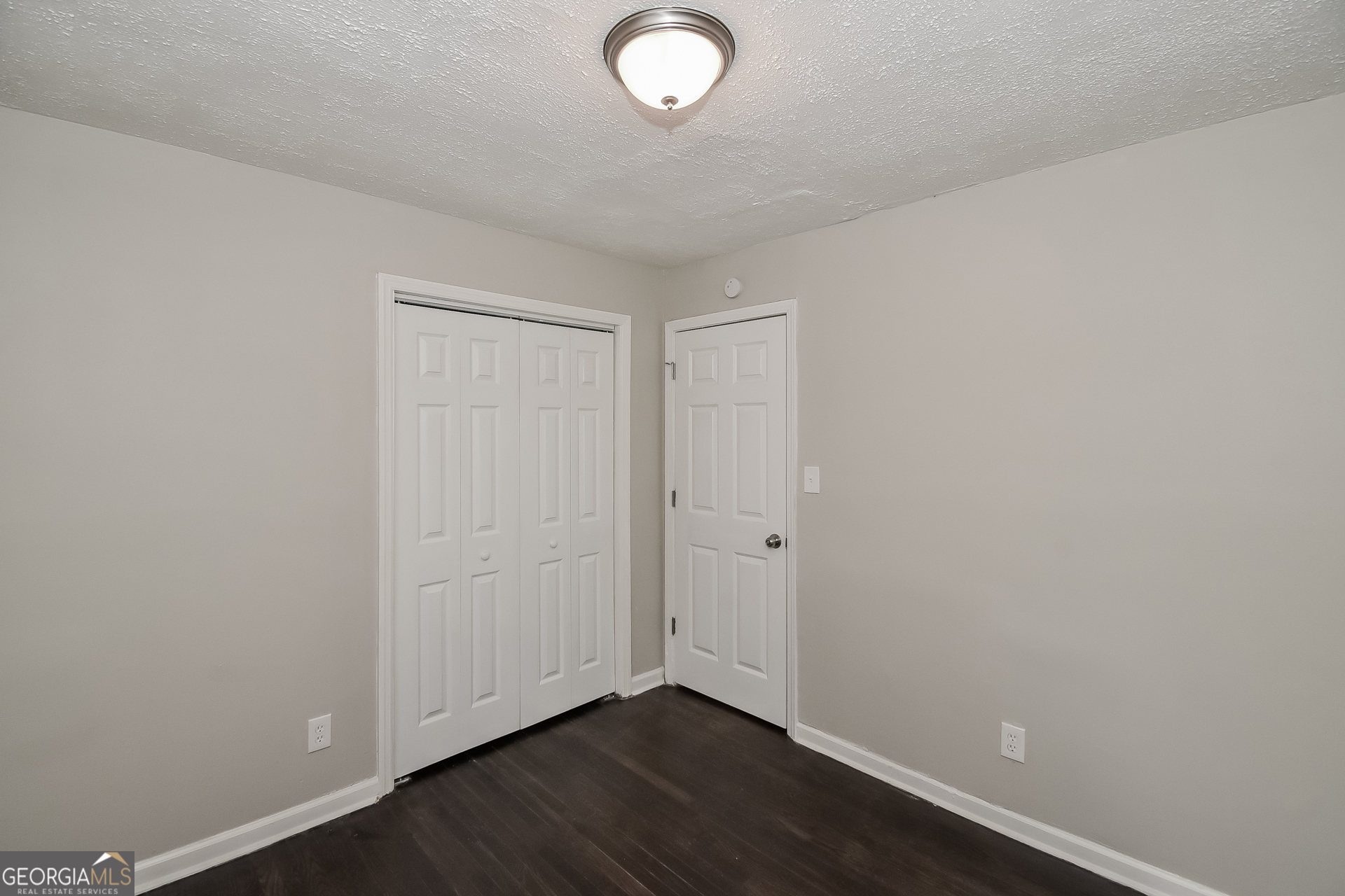 3803 Bakers Ferry Road Southwest Atlanta, GA 30331 - Photo 9 of 16 a view of room with wooden floor