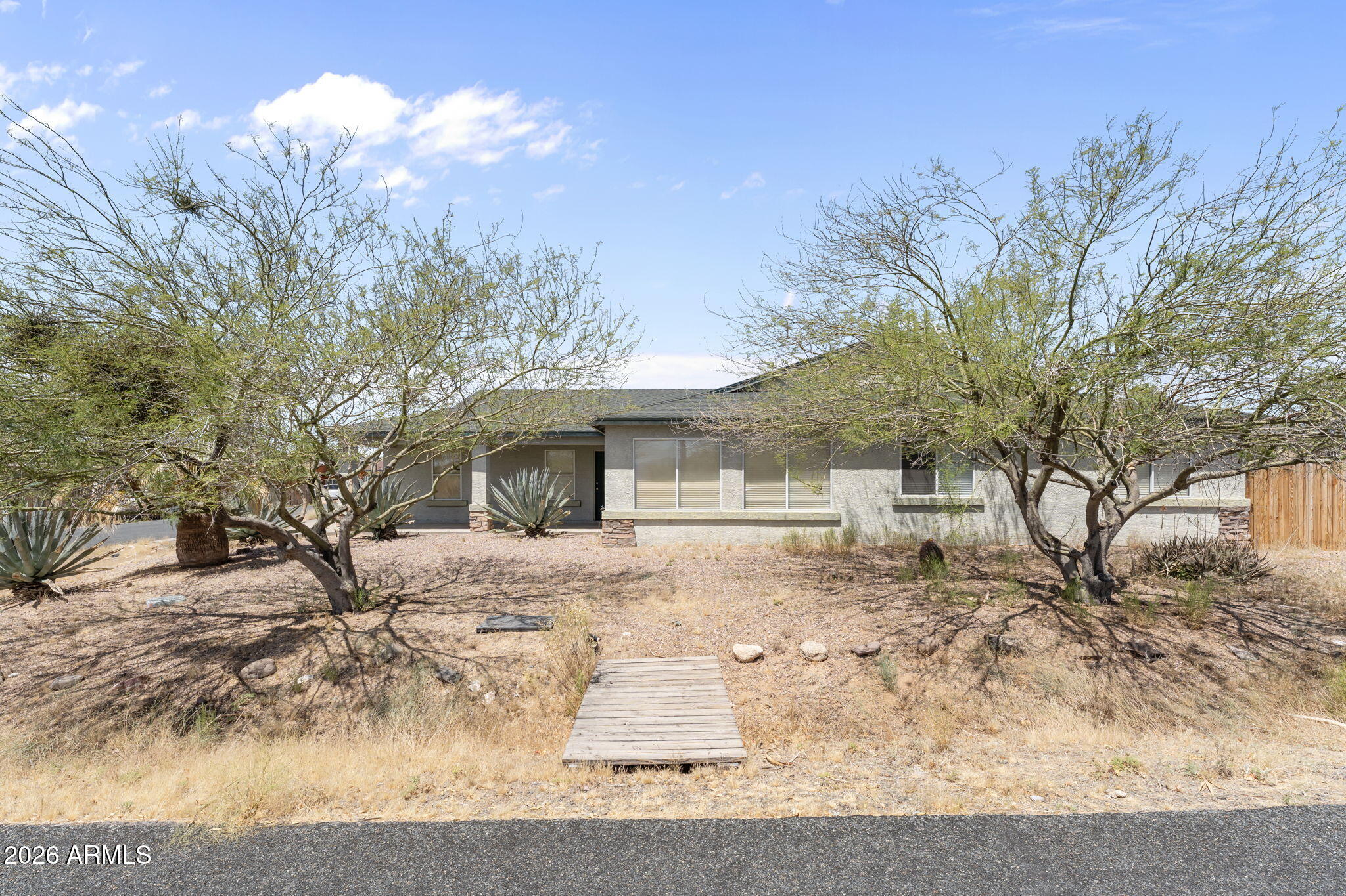 27144 Bennett Way Congress, AZ 85332 - Photo 3 of 33 a front view of a house with a yard covered with snow