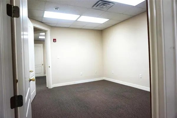 a view of a room with a hallway