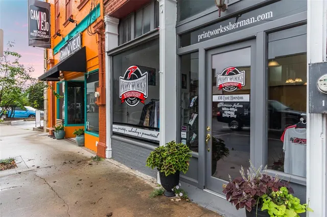 a view of a street with stores