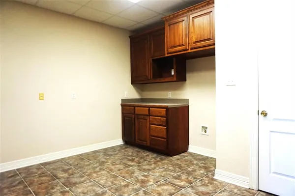 a kitchen with a stove and a microwave