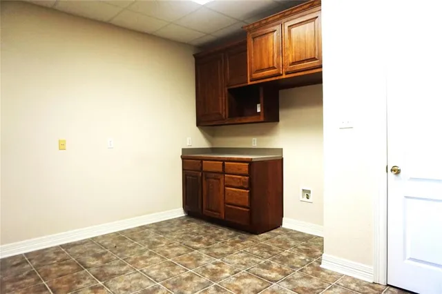 a kitchen with a stove and a microwave