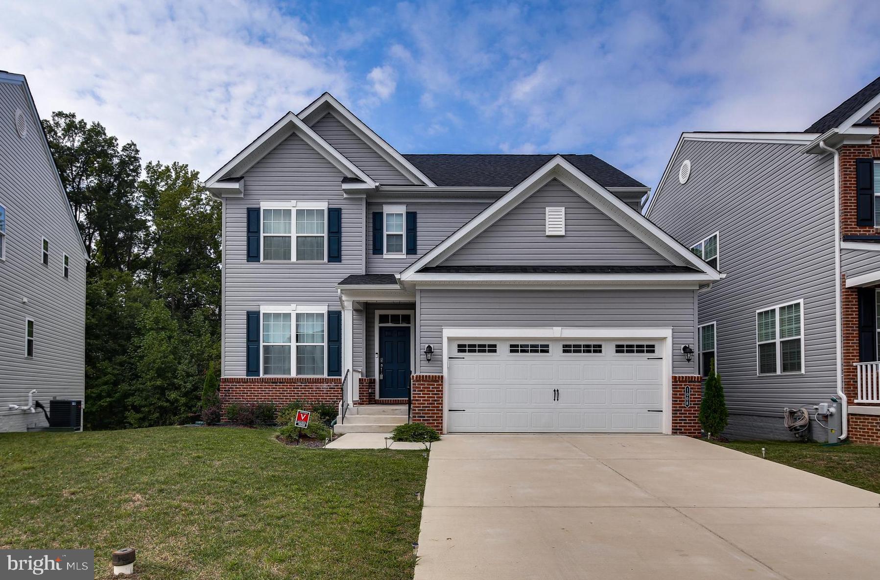 1008 Collier Run Road Baltimore, MD 21220 - Photo 1 of 33 a front view of a house with a yard and garage