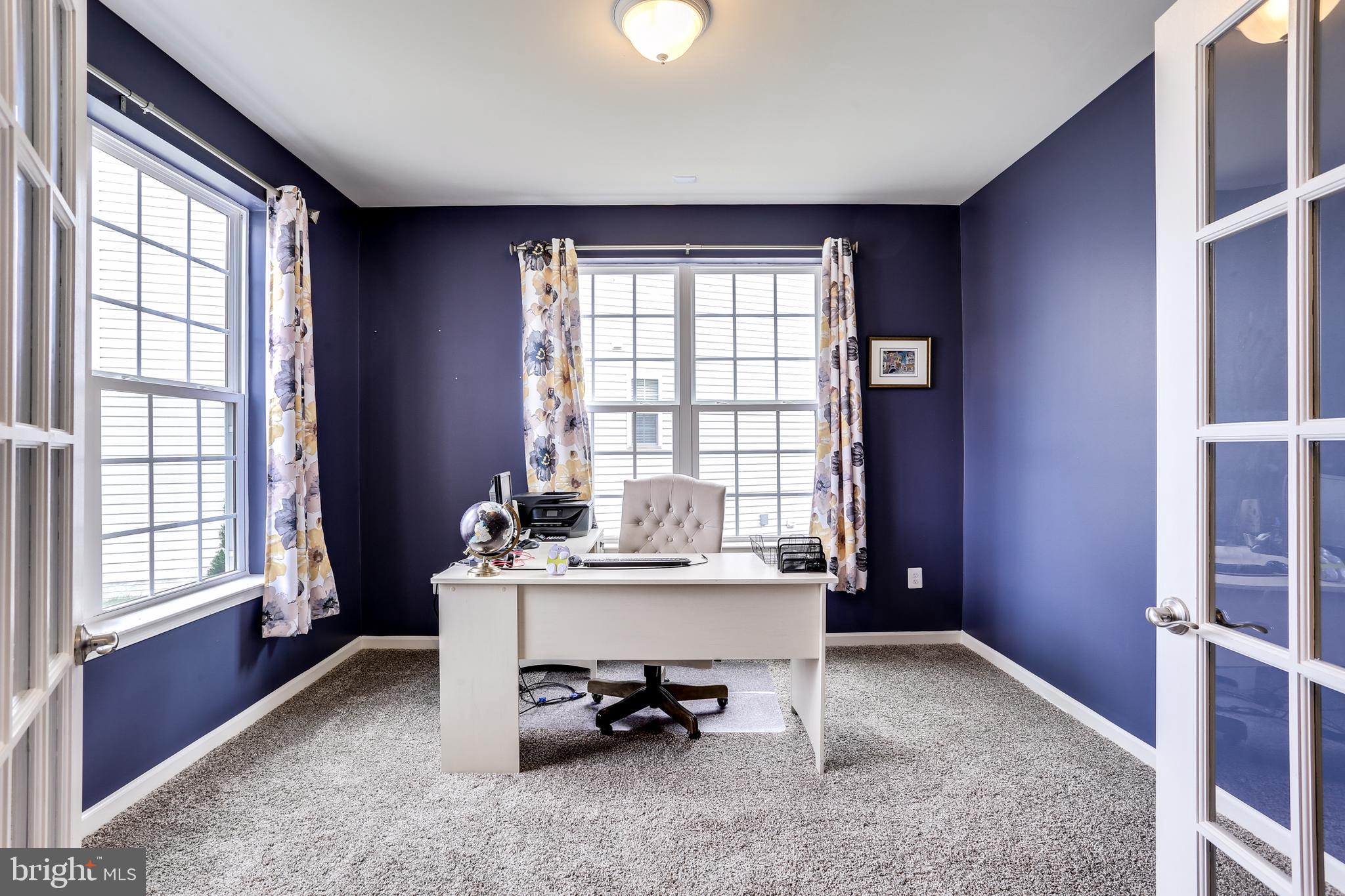 1008 Collier Run Road Baltimore, MD 21220 - Photo 6 of 33 a view of a workspace with furniture and a window