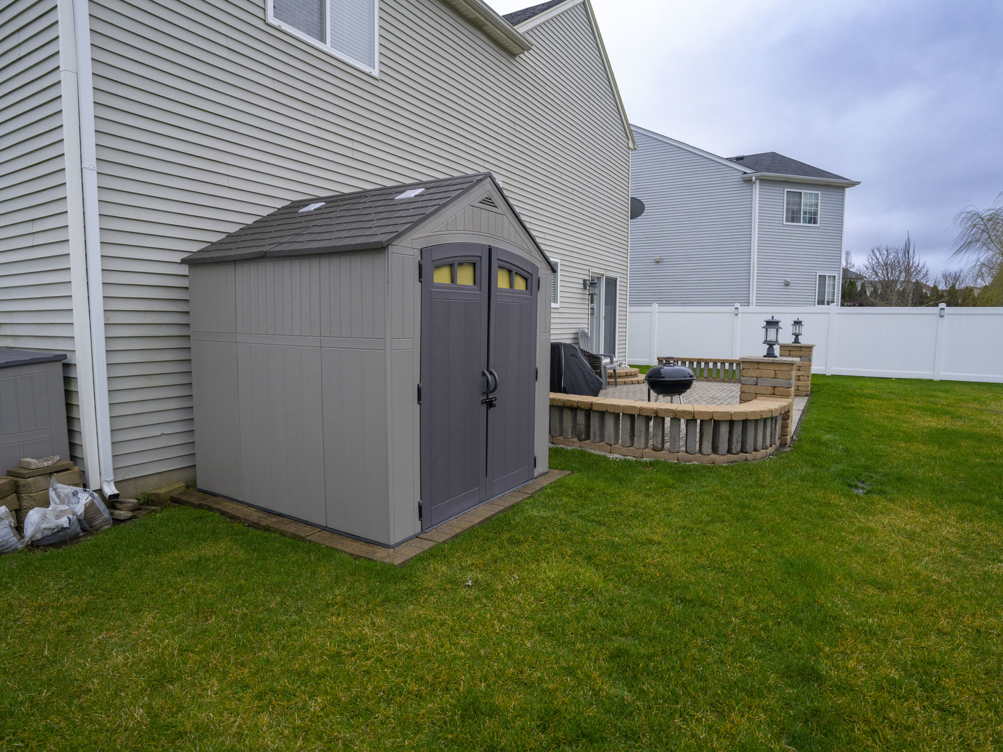 1717 Caton Ridge Drive Plainfield, IL 60586 - Photo 11 of 44 a backyard of a house with table and chairs