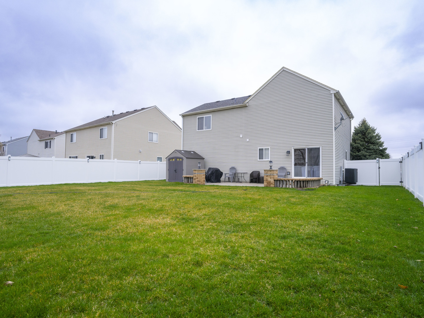 1717 Caton Ridge Drive Plainfield, IL 60586 - Photo 16 of 44 a view of a house with a backyard