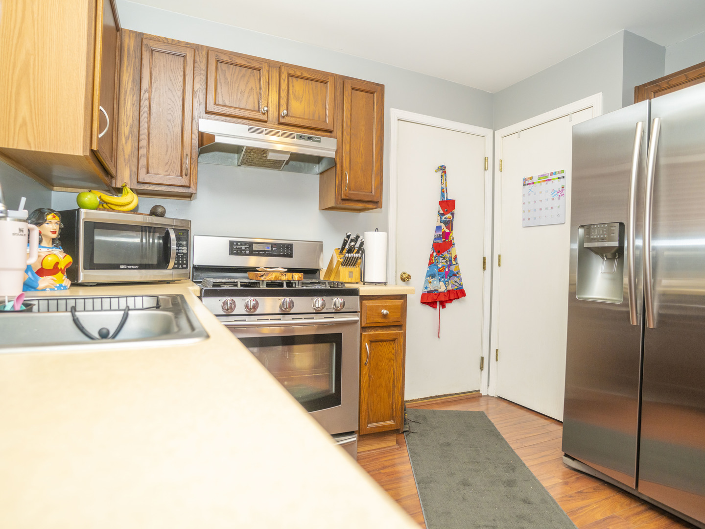1717 Caton Ridge Drive Plainfield, IL 60586 - Photo 20 of 44 a kitchen with stainless steel appliances granite countertop a refrigerator and a stove top oven
