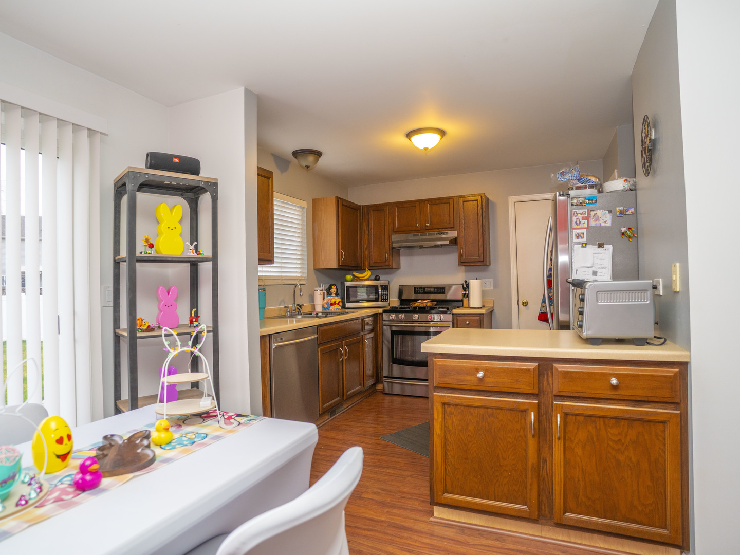 1717 Caton Ridge Drive Plainfield, IL 60586 - Photo 24 of 44 a kitchen view with furniture a counter space cabinets and appliances