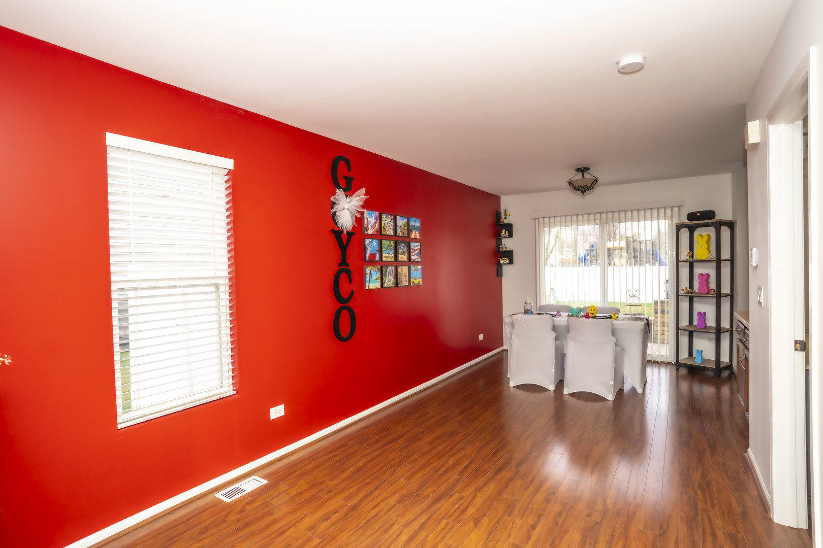 1717 Caton Ridge Drive Plainfield, IL 60586 - Photo 27 of 44 a view of a livingroom with wooden floor and a window