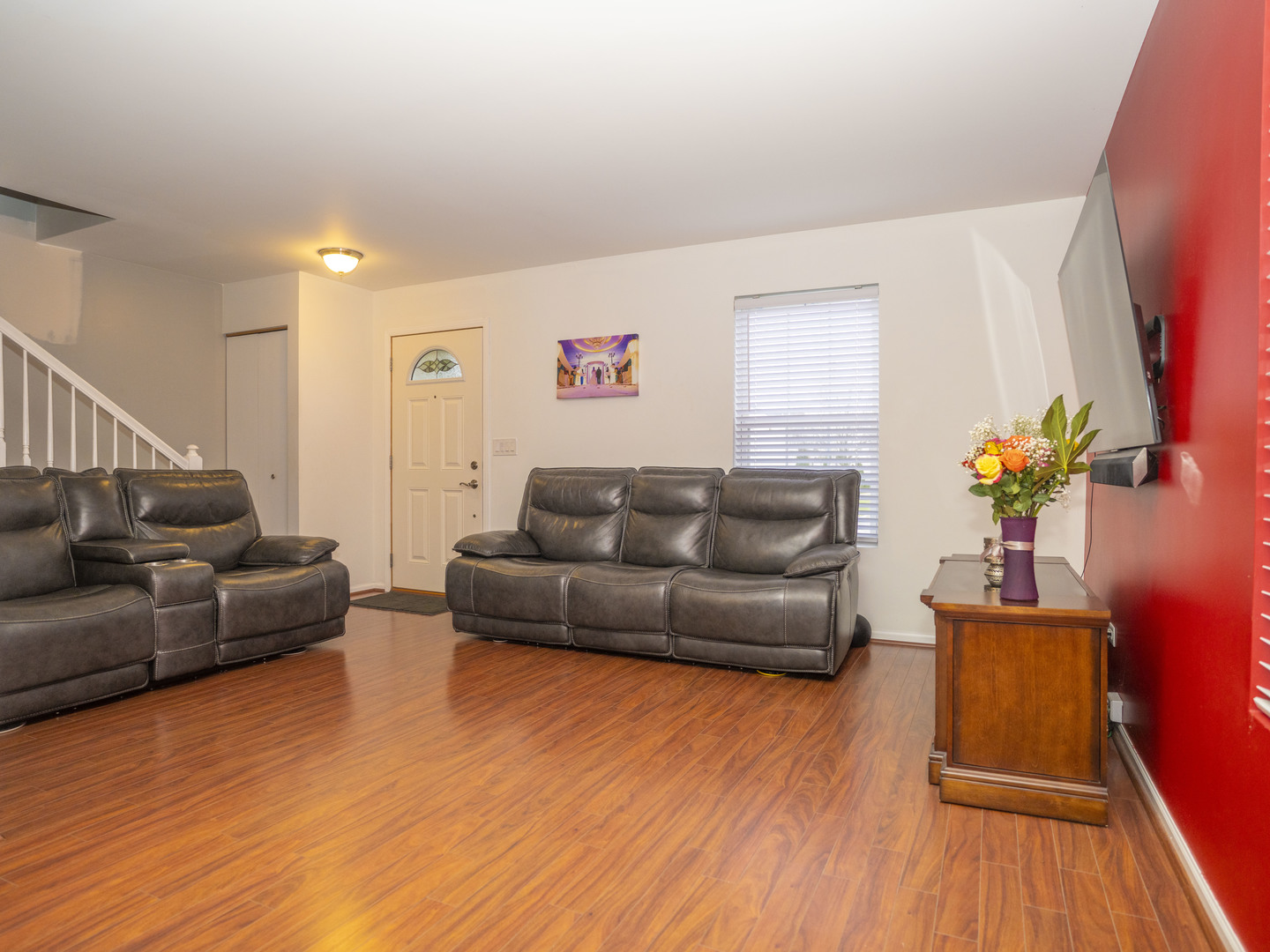 1717 Caton Ridge Drive Plainfield, IL 60586 - Photo 28 of 44 a living room with furniture and a wooden floor