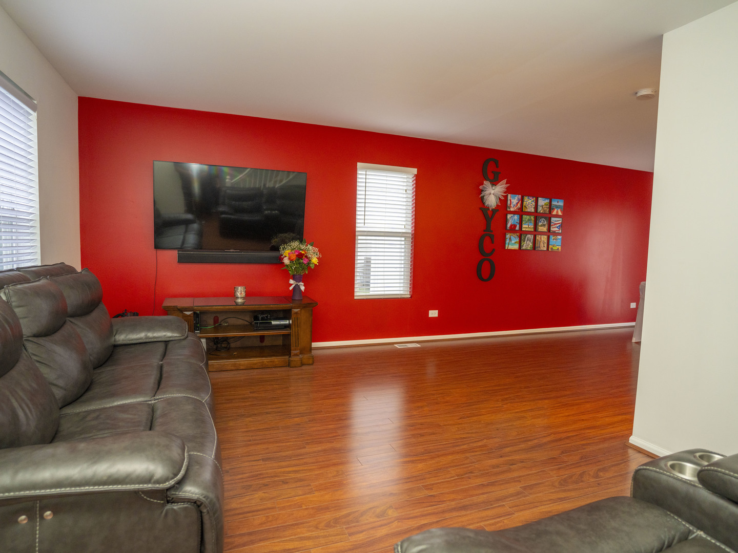 1717 Caton Ridge Drive Plainfield, IL 60586 - Photo 29 of 44 a living room with furniture and a flat screen tv