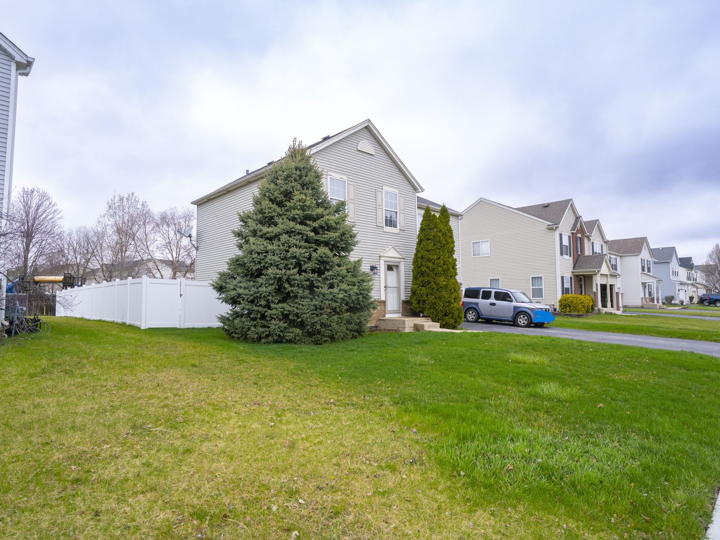 1717 Caton Ridge Drive Plainfield, IL 60586 - Photo 3 of 44 a view of a big house with a big yard and large trees