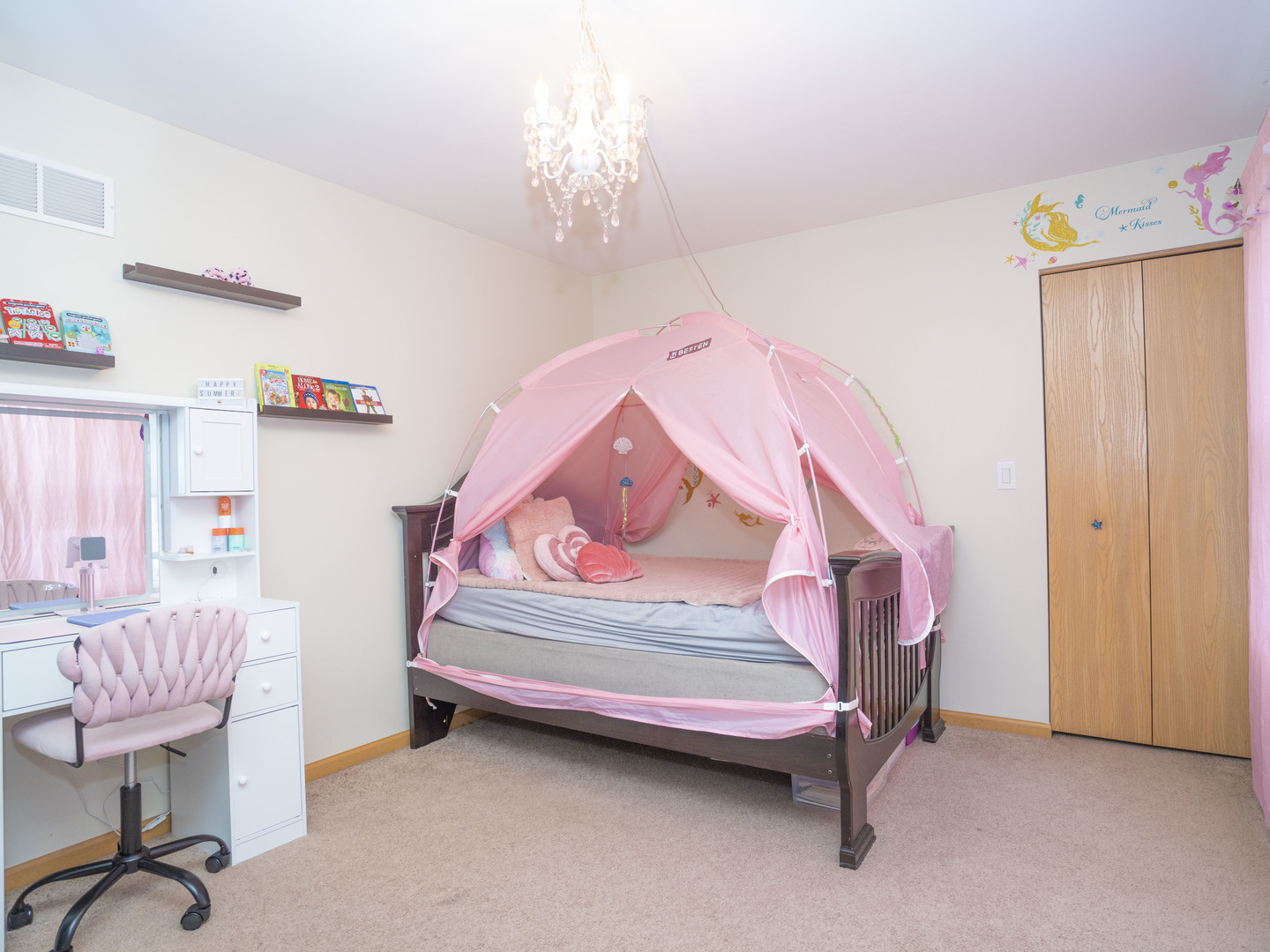 1717 Caton Ridge Drive Plainfield, IL 60586 - Photo 32 of 44 a bedroom with a bed and a chandelier