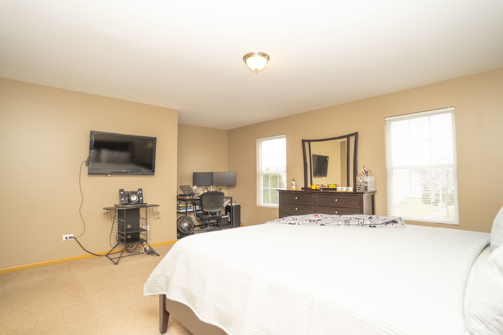 1717 Caton Ridge Drive Plainfield, IL 60586 - Photo 42 of 44 a bedroom with a bed and large windows