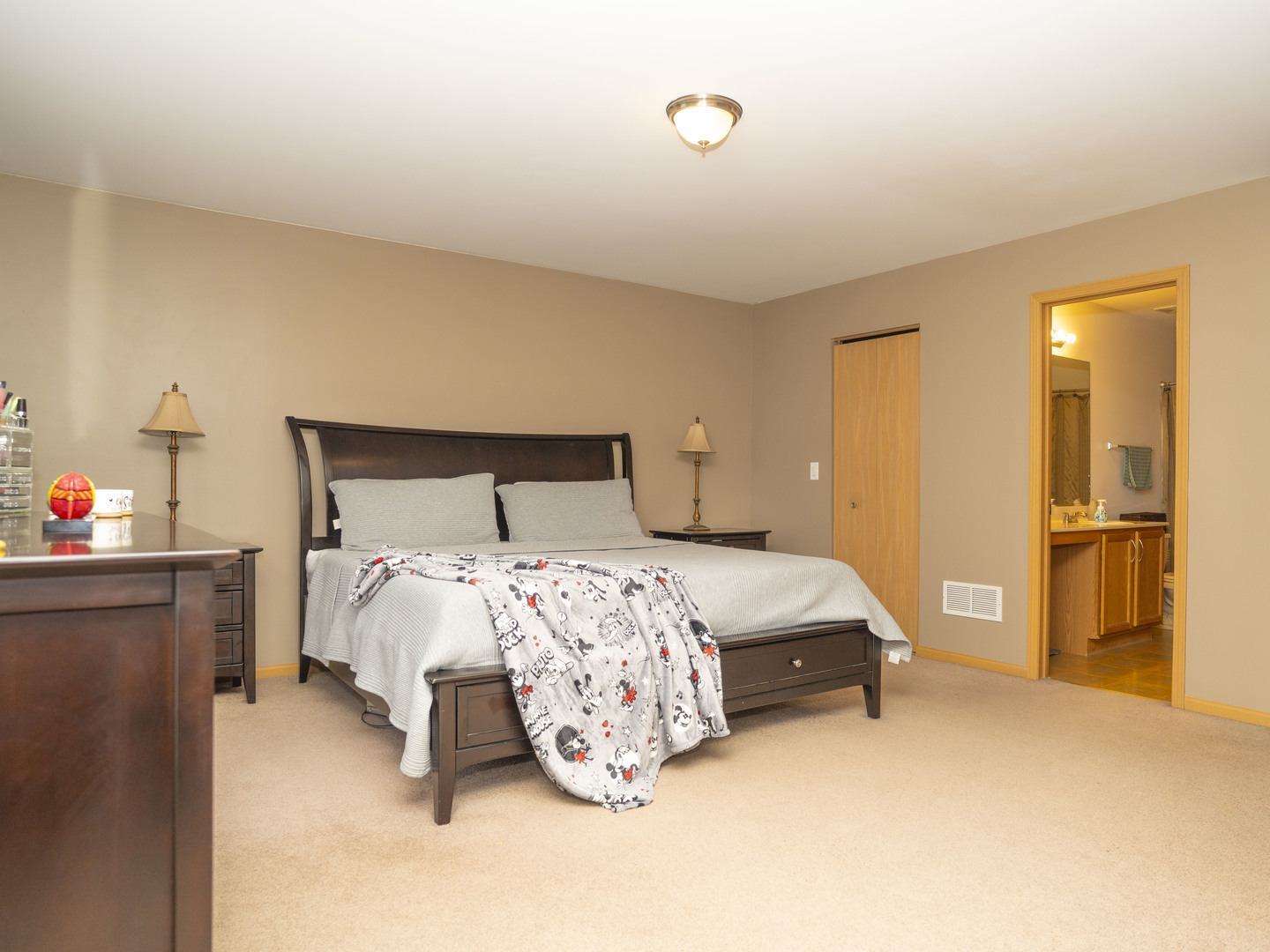 1717 Caton Ridge Drive Plainfield, IL 60586 - Photo 44 of 44 a bedroom with a bed and a chandelier