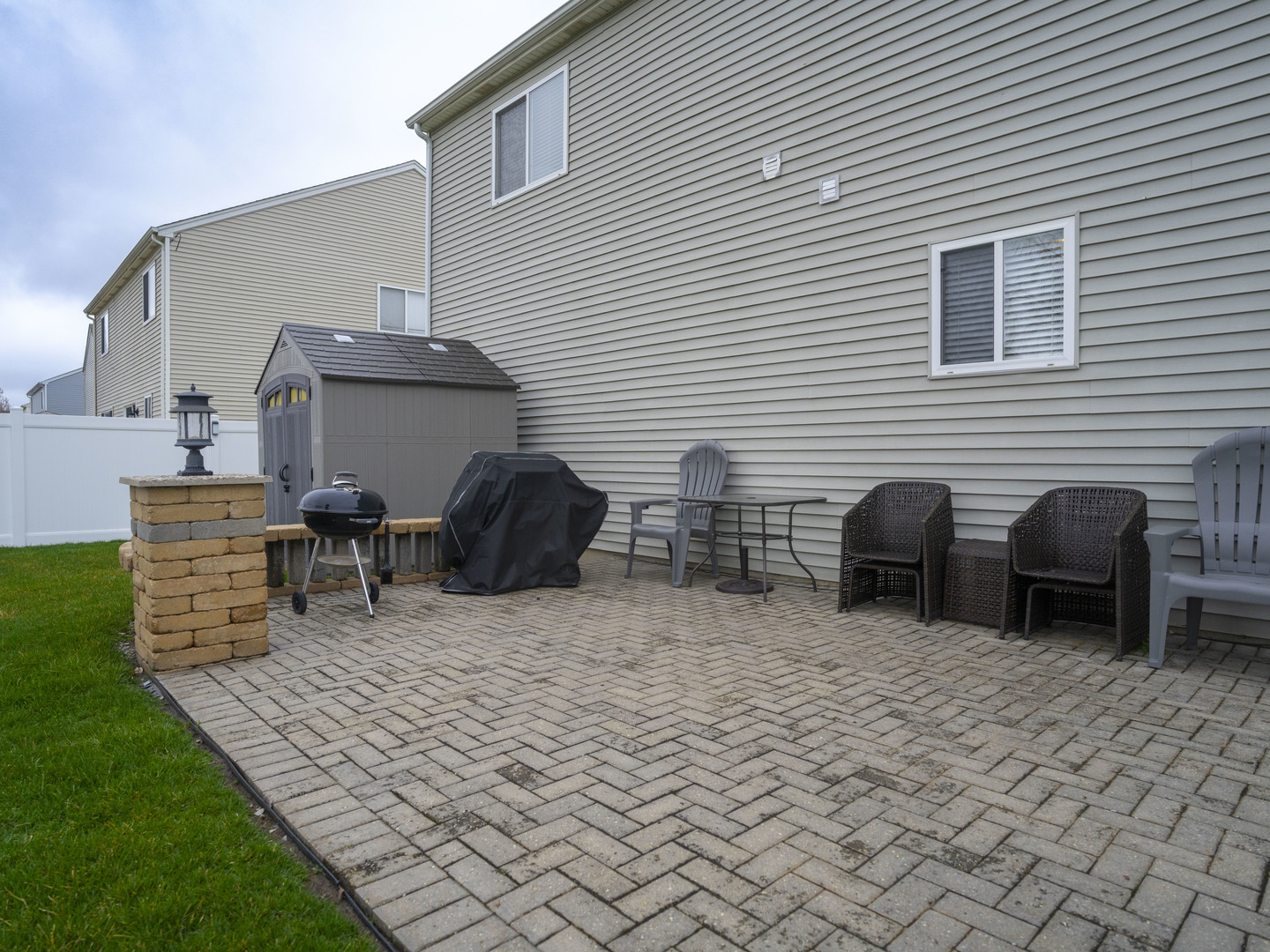 1717 Caton Ridge Drive Plainfield, IL 60586 - Photo 7 of 44 a view of a patio with table and chairs and a barbeque
