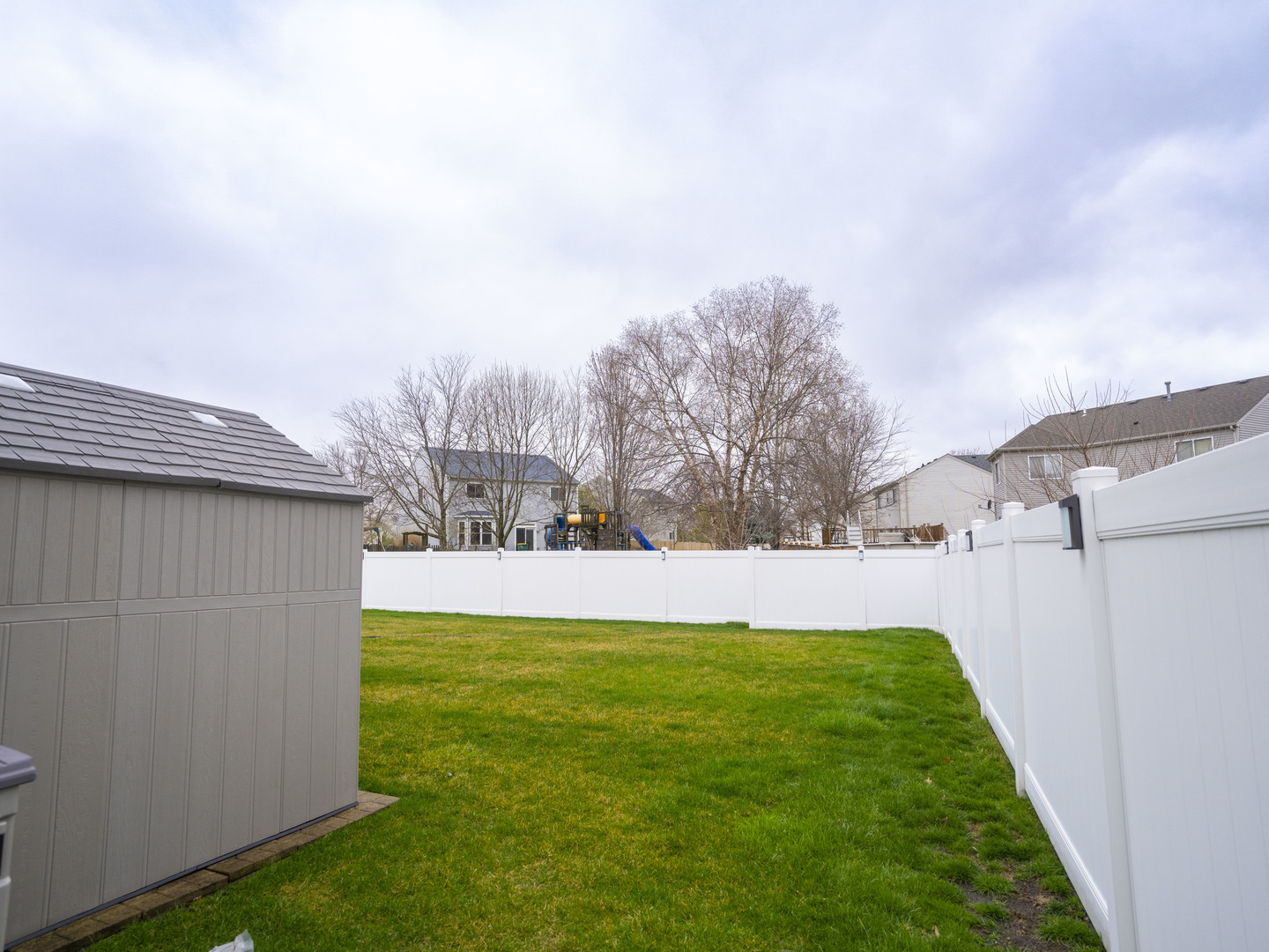1717 Caton Ridge Drive Plainfield, IL 60586 - Photo 10 of 44 a view of a backyard with large trees
