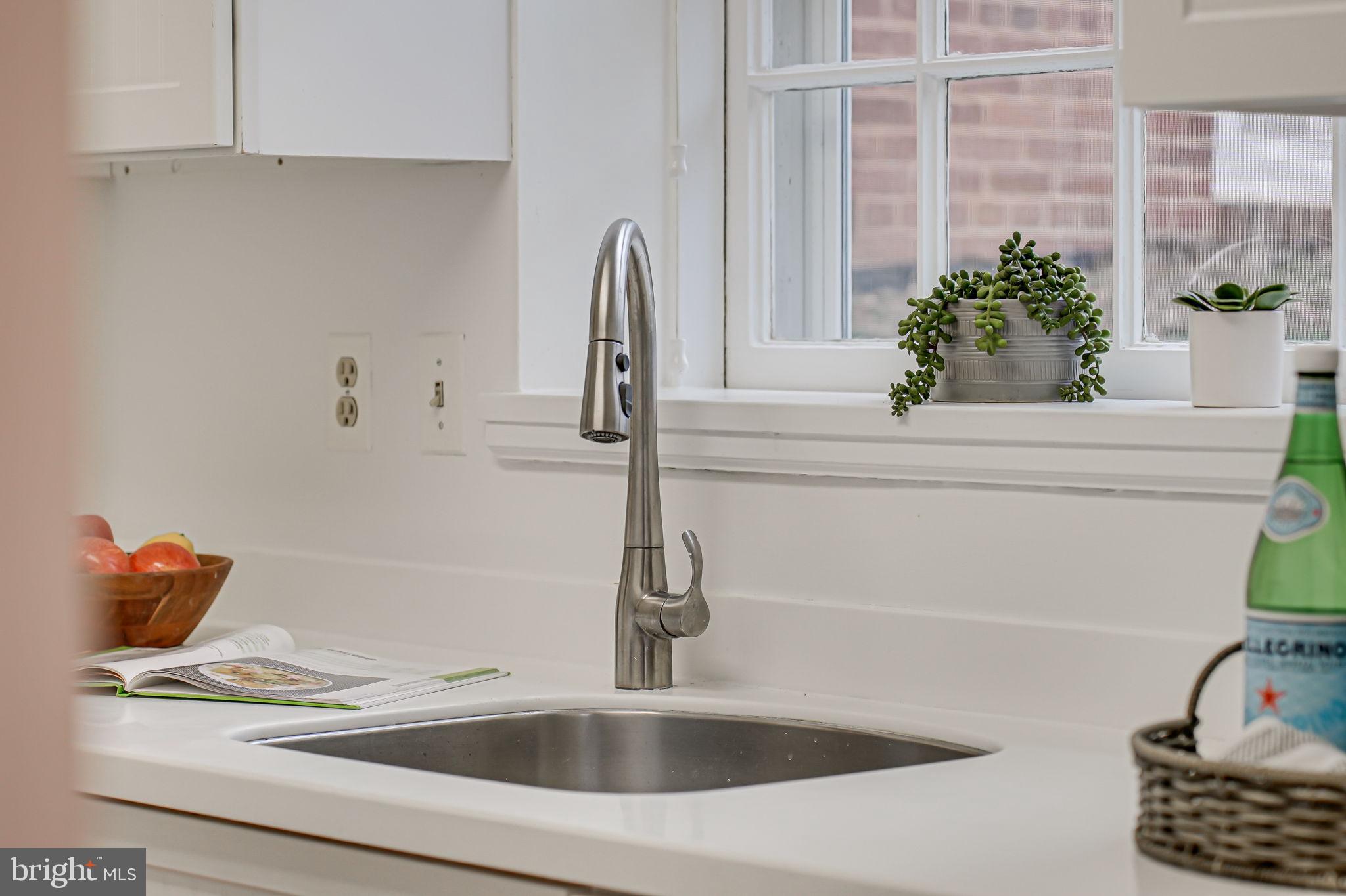 3701 39th Street Northwest, Unit A181 Washington, DC 20016 - Photo 11 of 68 a bathroom with a sink and a window