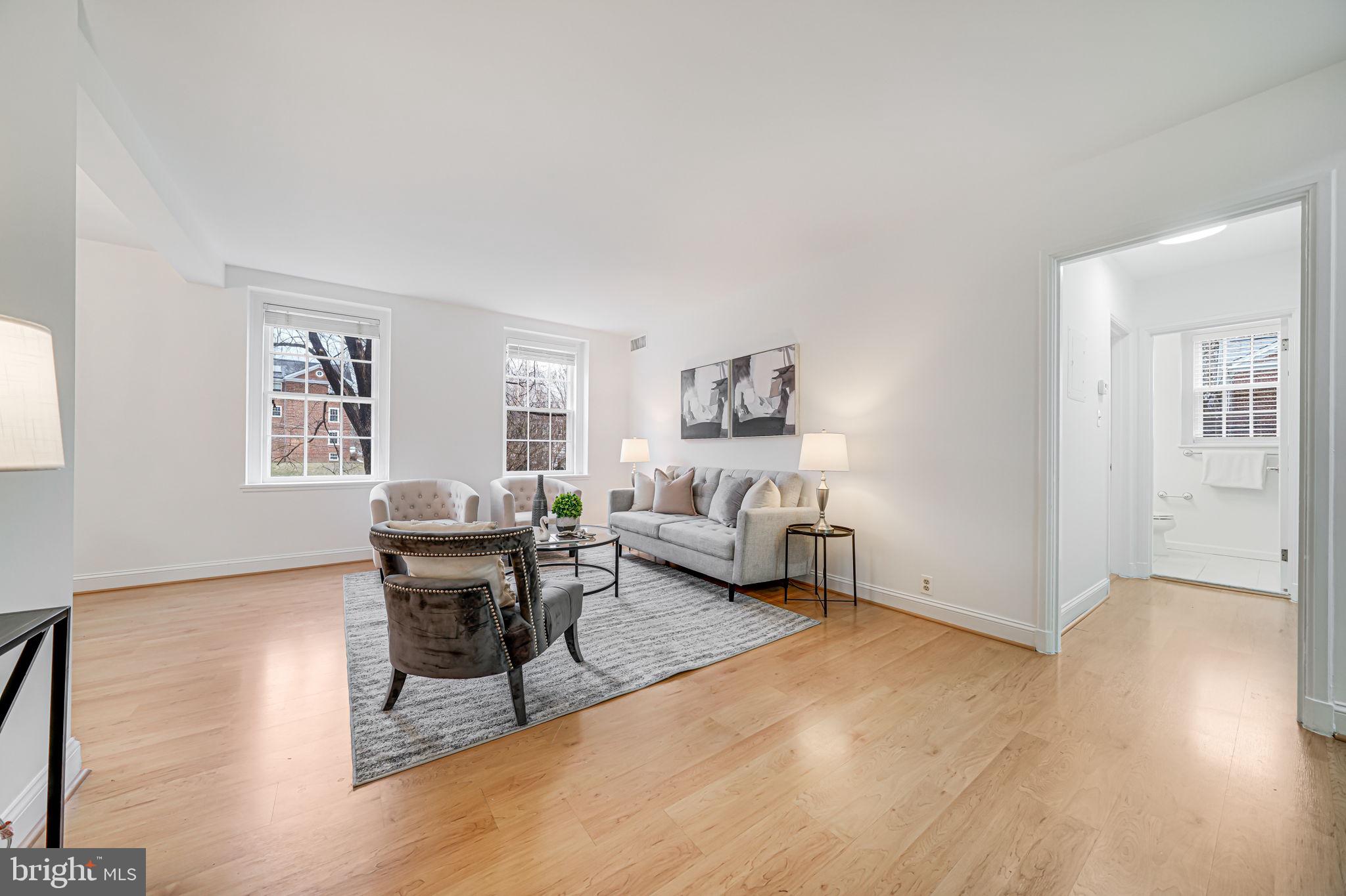3701 39th Street Northwest, Unit A181 Washington, DC 20016 - Photo 14 of 68 a living room with furniture and a wooden floor