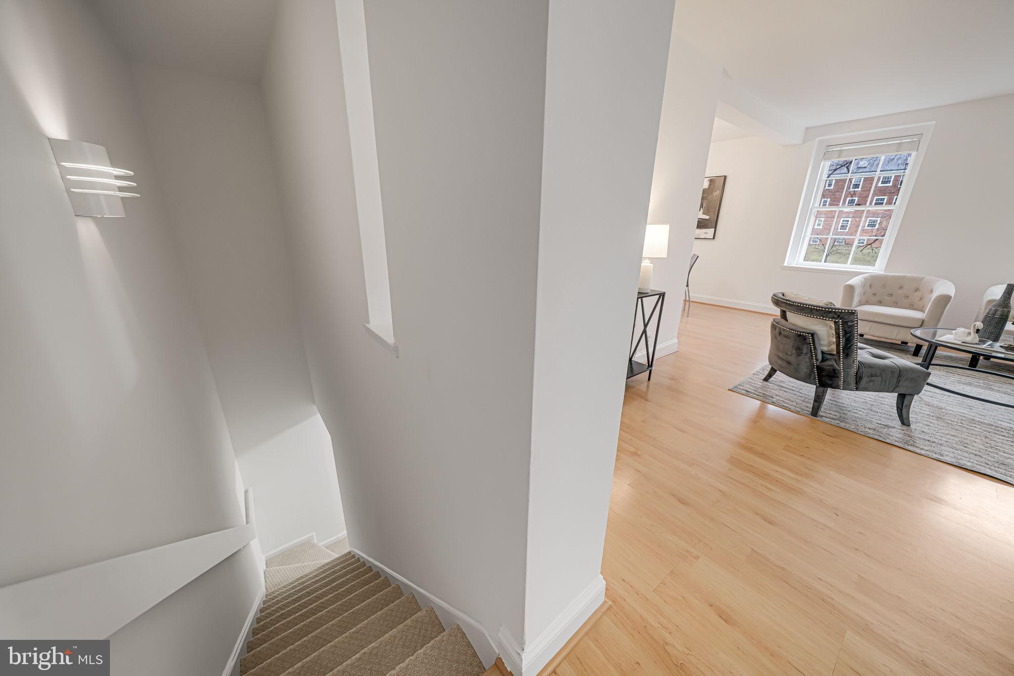 3701 39th Street Northwest, Unit A181 Washington, DC 20016 - Photo 21 of 68 a view of a room with wooden floor and furniture