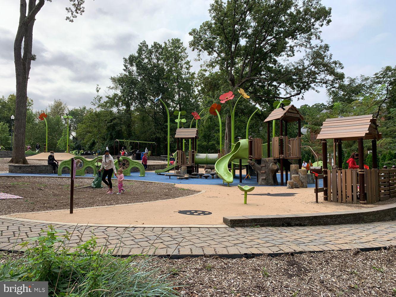 3701 39th Street Northwest, Unit A181 Washington, DC 20016 - Photo 51 of 68 a view of a park with swings and slides