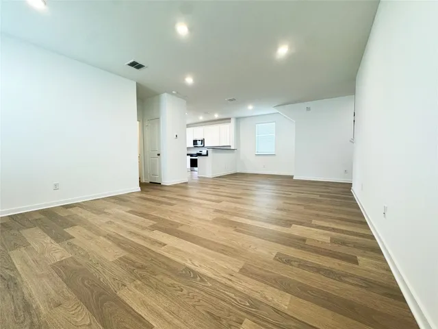 a kitchen with a stove a sink and a microwave