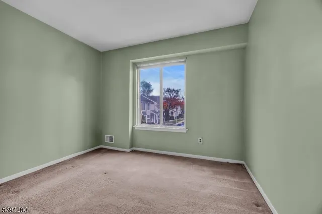 a view of room and a window